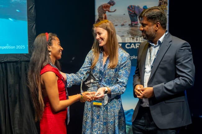 A person receiving a prize.