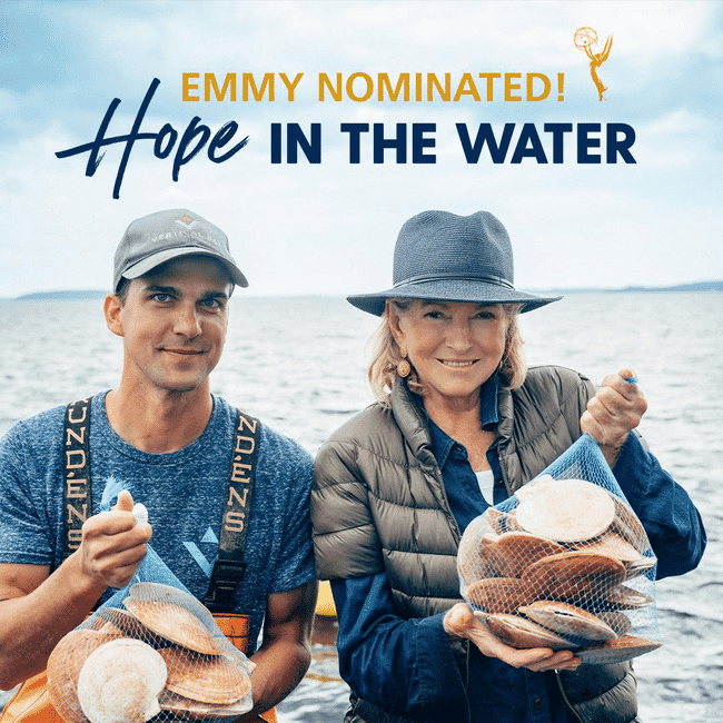 Two people holding scallops.